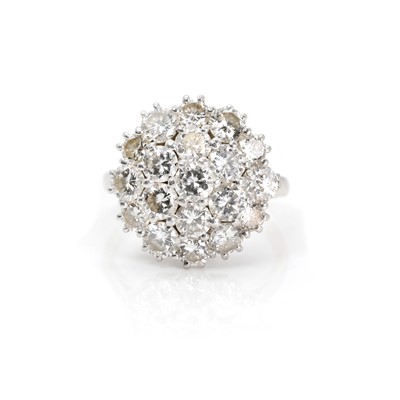 Lot 1111 - A platinum and diamond cluster ring