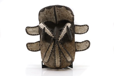 Lot 490 - An African carved wood and stud 'Spider' mask