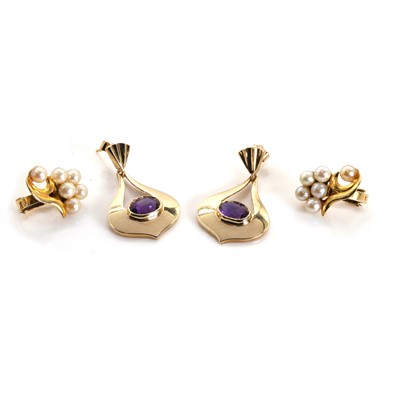 Lot 1302 - A pair of amethyst drop stud earrings and a pair of seed pearl cluster earrings