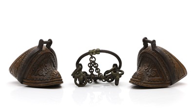 Lot 465 - A pair of Chilean carved and iron-mounted stirrups