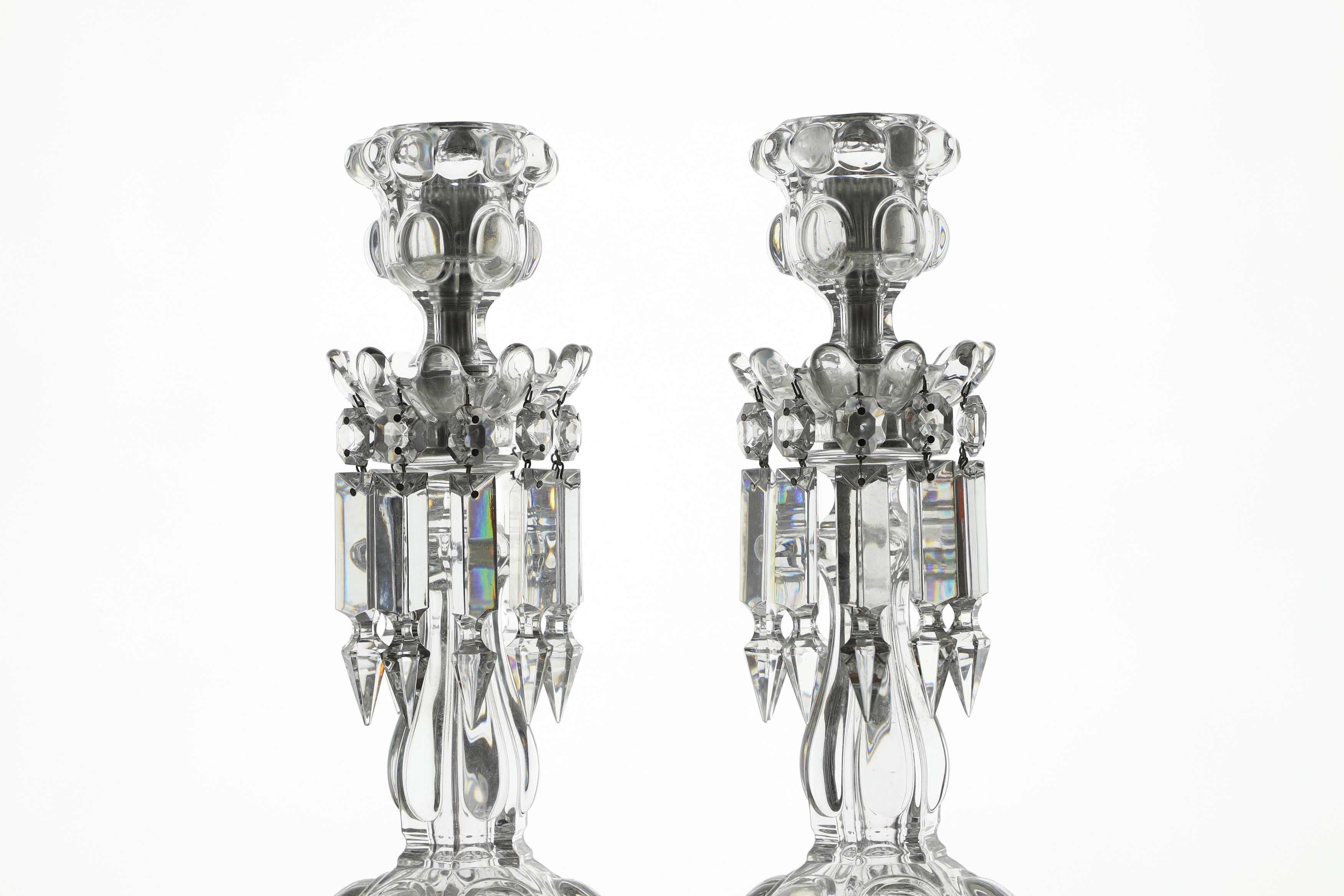 Lot 186 A pair of Baccarat glass candlesticks
