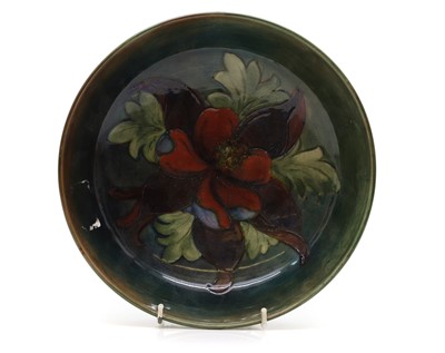 Lot 153 - A William Moorcroft 'Columbine' pattern bowl