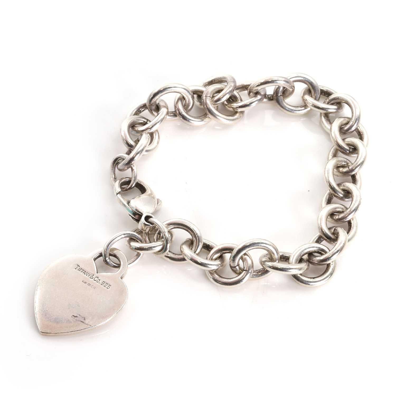 Lot 1275 - A sterling silver heart tag bracelet by Tiffany & Co.