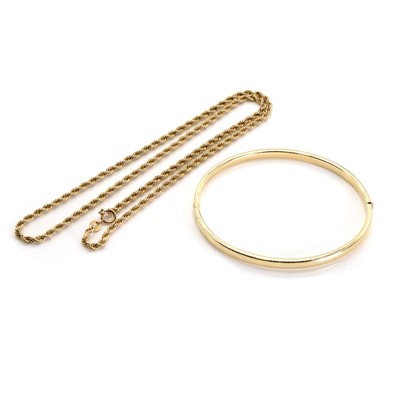 Lot 1288 - A 9ct gold bangle and a 9ct gold rope twist chain