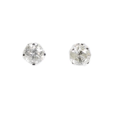 Lot 1097 - A pair of white gold diamond stud earrings