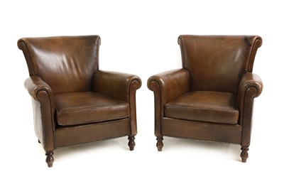 Lot 601 - A pair of brown leather armchairs