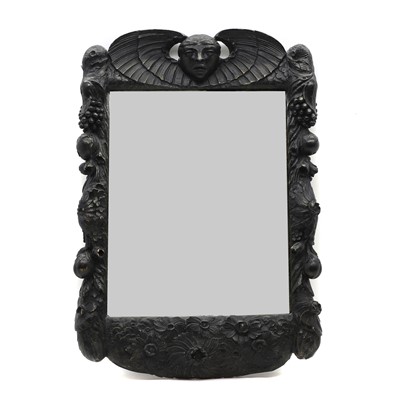 Lot 621 - An ebonised oak mirror