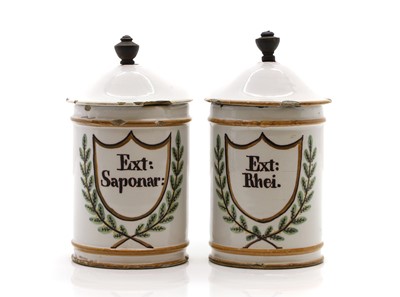 Lot 257 - A pair of pottery apothecary jars and covers