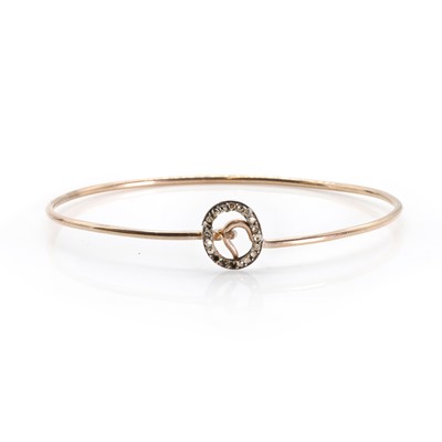 Lot 1053 - A rose cut diamond set bangle