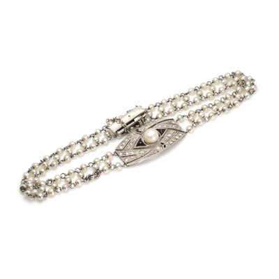 Lot 1061 - A French Art Deco platinum, diamond and pearl bracelet