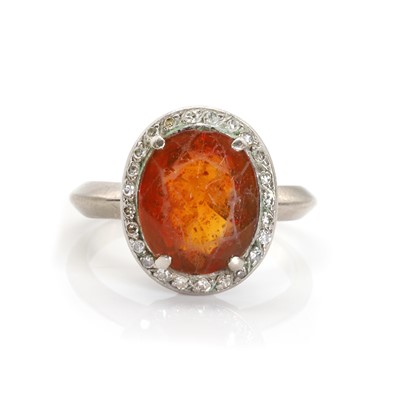 Lot 1188 - An orange citrine and diamond cluster ring