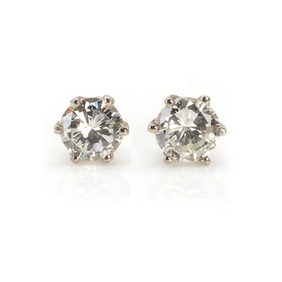 Lot 72 - A pair of diamond single stone stud earrings