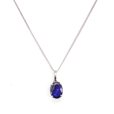 Lot 1161 - A sapphire pendant and chain