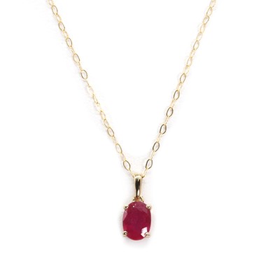 Lot 1180 - A treated ruby pendant and chain