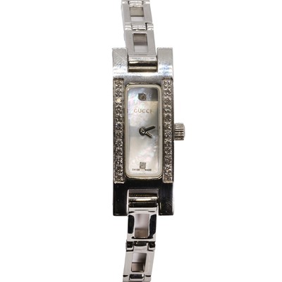 Lot 1509 - A ladies' stainless steel diamond set Gucci quartz bracelet watch