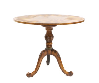 Lot 669 - A walnut tripod table