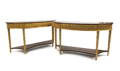 Lot 661 - A pair of inlaid walnut and parcel gilt console tables