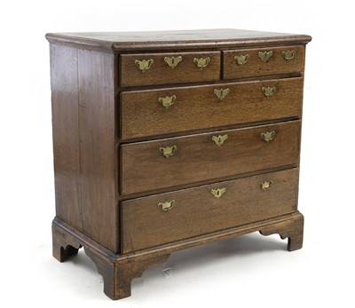 Lot 629 - A George III oak chest of drawers