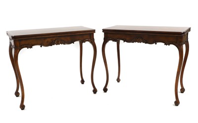 Lot 701 - A pair of walnut card tables