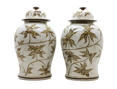 Lot 360 - A pair of temple vases and covers