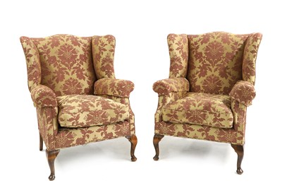 Lot 643 - A pair of wing back armchairs