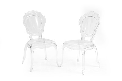 Lot 700 - A pair of clear polycarbonate open armchairs