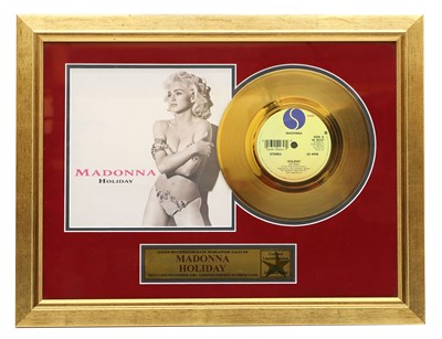 Lot 536 - A framed gold disc