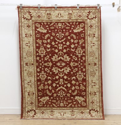 Lot 572 - A graduated set of three of Agra rugs