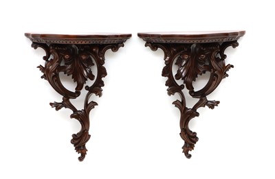 Lot 474 - A pair of carved mahogany wall brackets