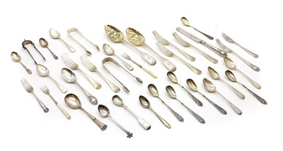 Lot 21 - A collection of flatware and tongs