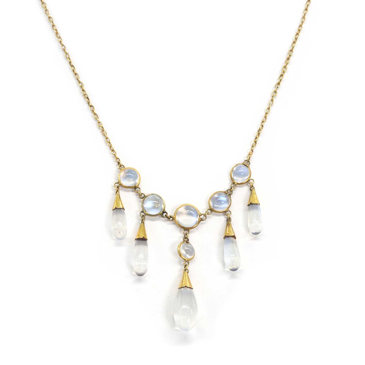 Lot 1049 - An early 20th century moonstone fringe necklace and a pair of moonstone screw back earrings