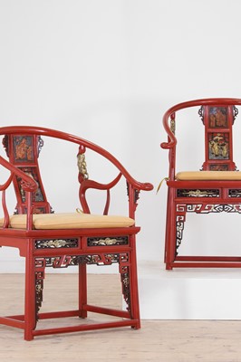 Lot 636 - A pair of red lacquer horseshoe-back chairs
