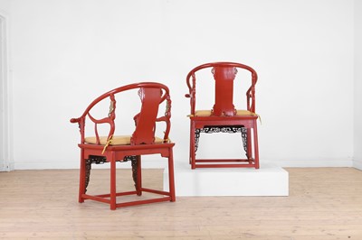 Lot 636 - A pair of red lacquer horseshoe-back chairs