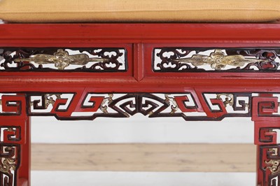 Lot 636 - A pair of red lacquer horseshoe-back chairs