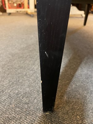 Lot 633 - An imitation leopard-skin and ebonised wooden ottoman
