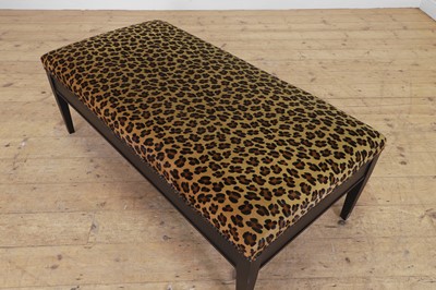 Lot 633 - An imitation leopard-skin and ebonised wooden ottoman