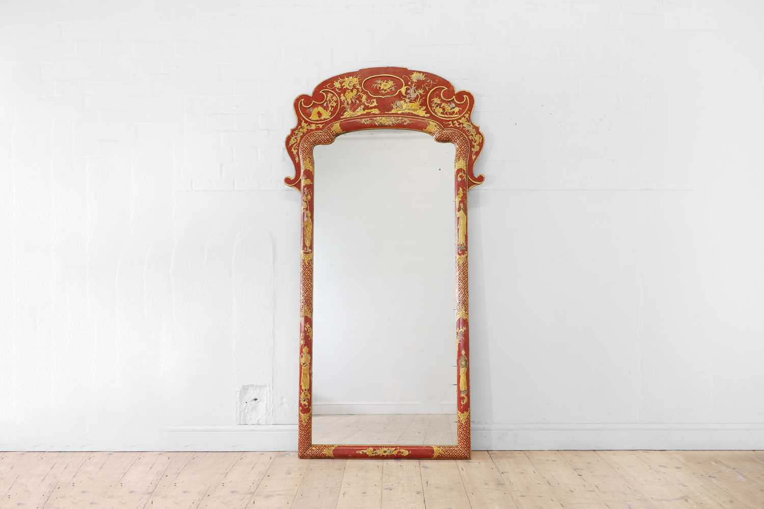 Lot 635 - A George I-style red and gilt japanned pier mirror