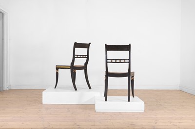 Lot 642 - A pair of Regency ebonised wooden side chairs