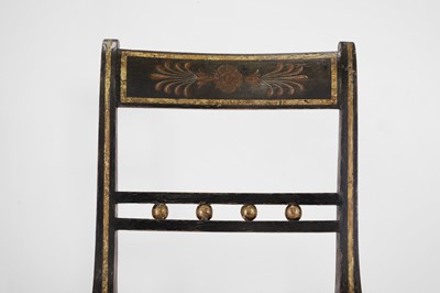 Lot 642 - A pair of Regency ebonised wooden side chairs