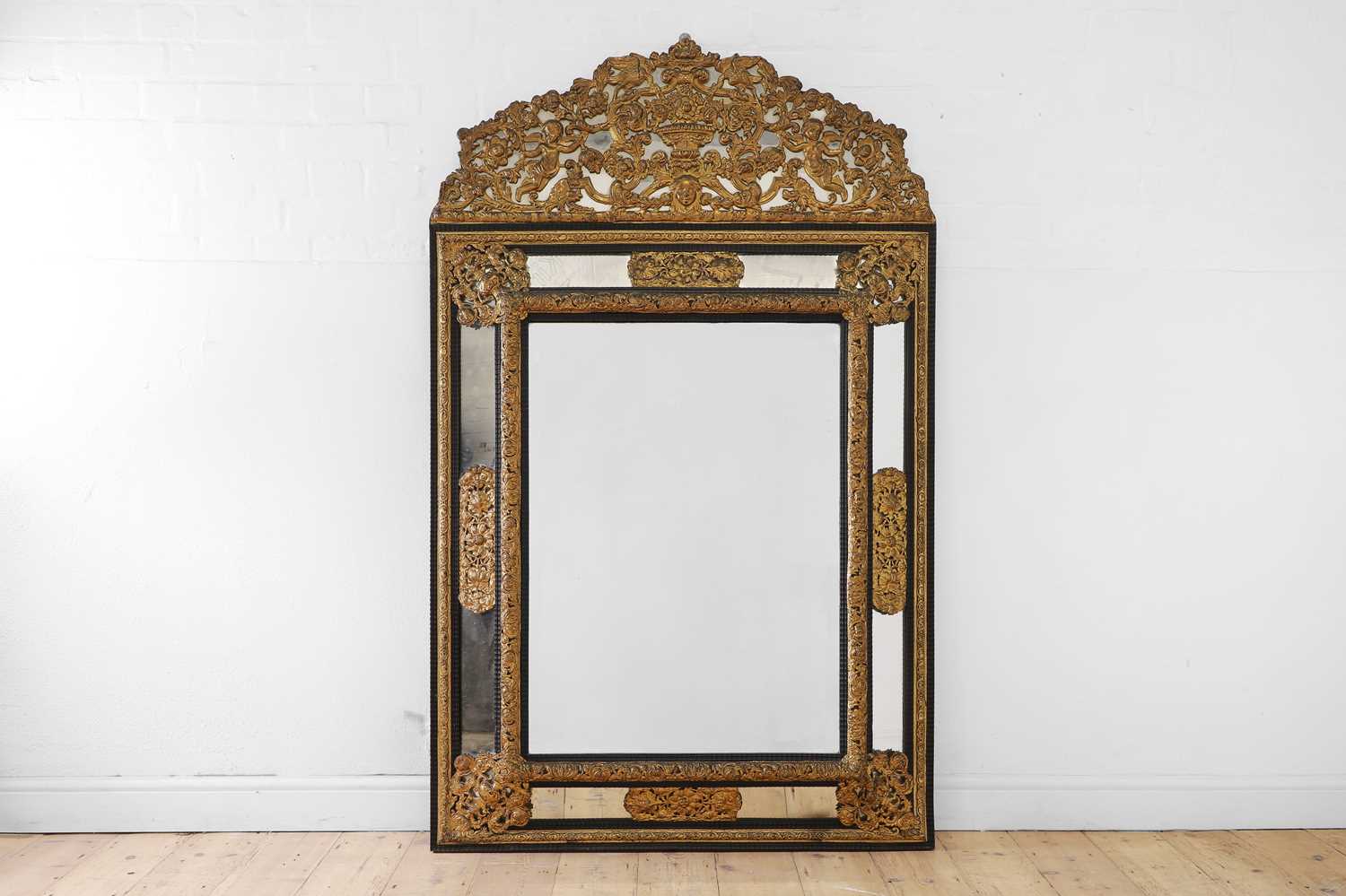 Lot 631 - A baroque gilt-metal and ebonised wooden pier mirror