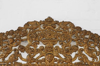 Lot 631 - A baroque gilt-metal and ebonised wooden pier mirror