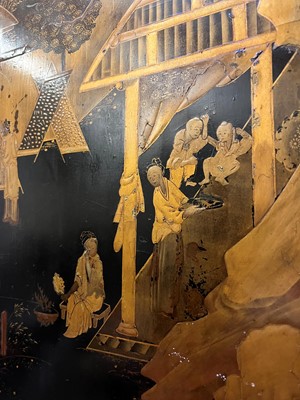 Lot 643 - A black and gilt lacquer folding screen