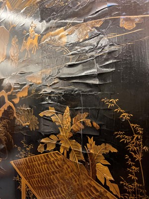 Lot 643 - A black and gilt lacquer folding screen