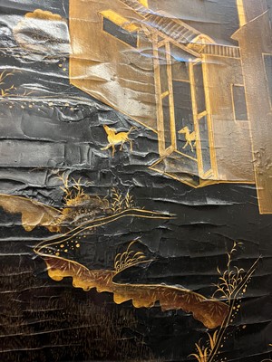 Lot 643 - A black and gilt lacquer folding screen