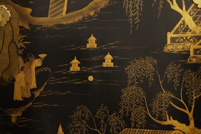 Lot 643 - A black and gilt lacquer folding screen