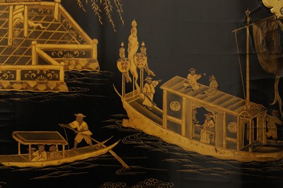 Lot 643 - A black and gilt lacquer folding screen