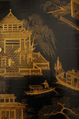 Lot 643 - A black and gilt lacquer folding screen