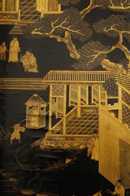 Lot 643 - A black and gilt lacquer folding screen