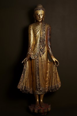 Lot 637 - A very large lacquered and giltwood figure of the standing Buddha