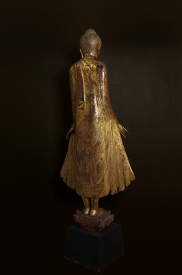 Lot 637 - A very large lacquered and giltwood figure of the standing Buddha